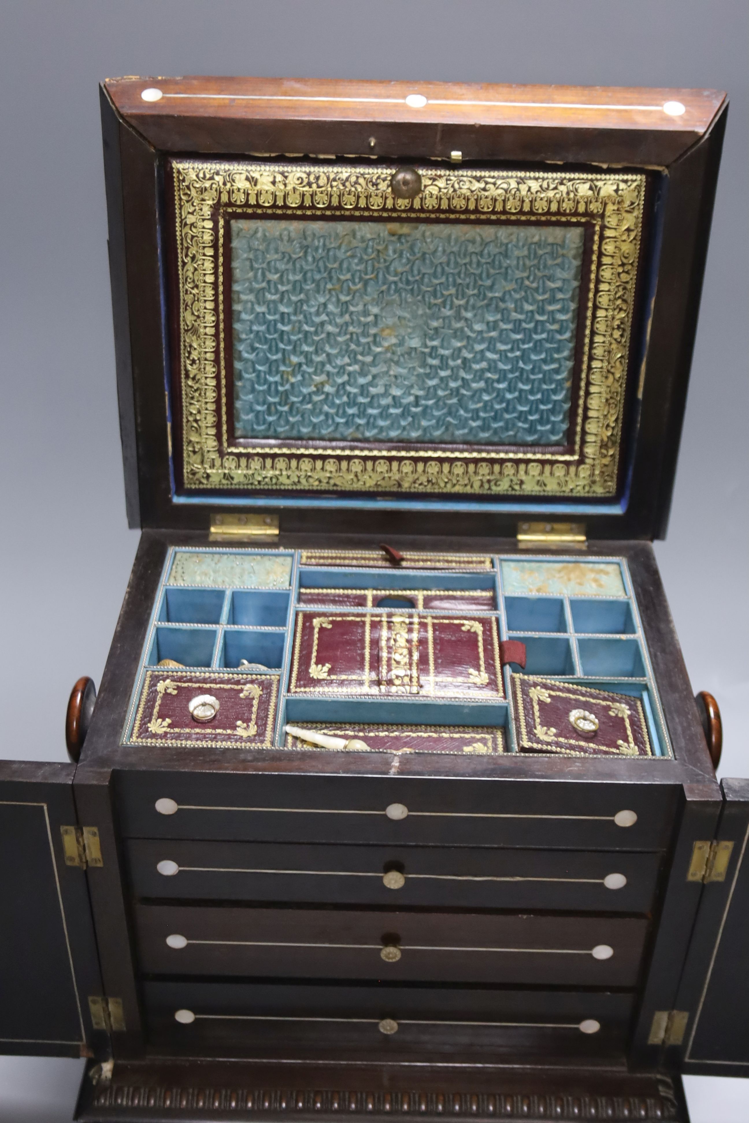 A William IV mother of pearl inset rosewood work box, height 36cm, containing mother-of-pearl and ivory items